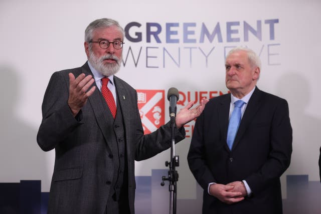 Former taoiseach Bertie Ahern (right) watches on as former Sinn Fein president Gerry Adams speaks to the media (Liam McBurney/PA)
