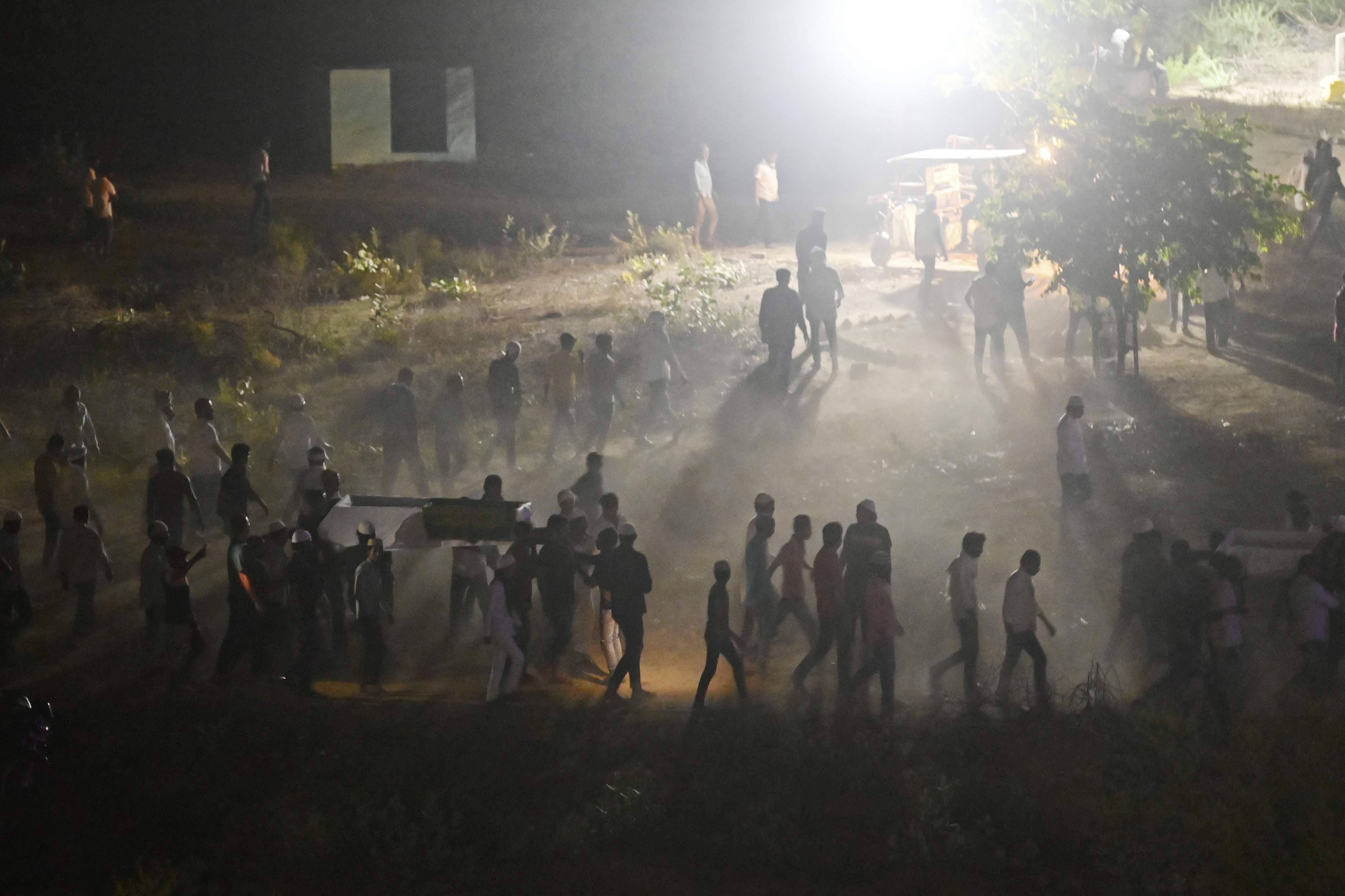 Mourners carry the bodies of a former Indian member of parliament Atiq Ahmed and his brother Ashraf Ahmed on 16 April