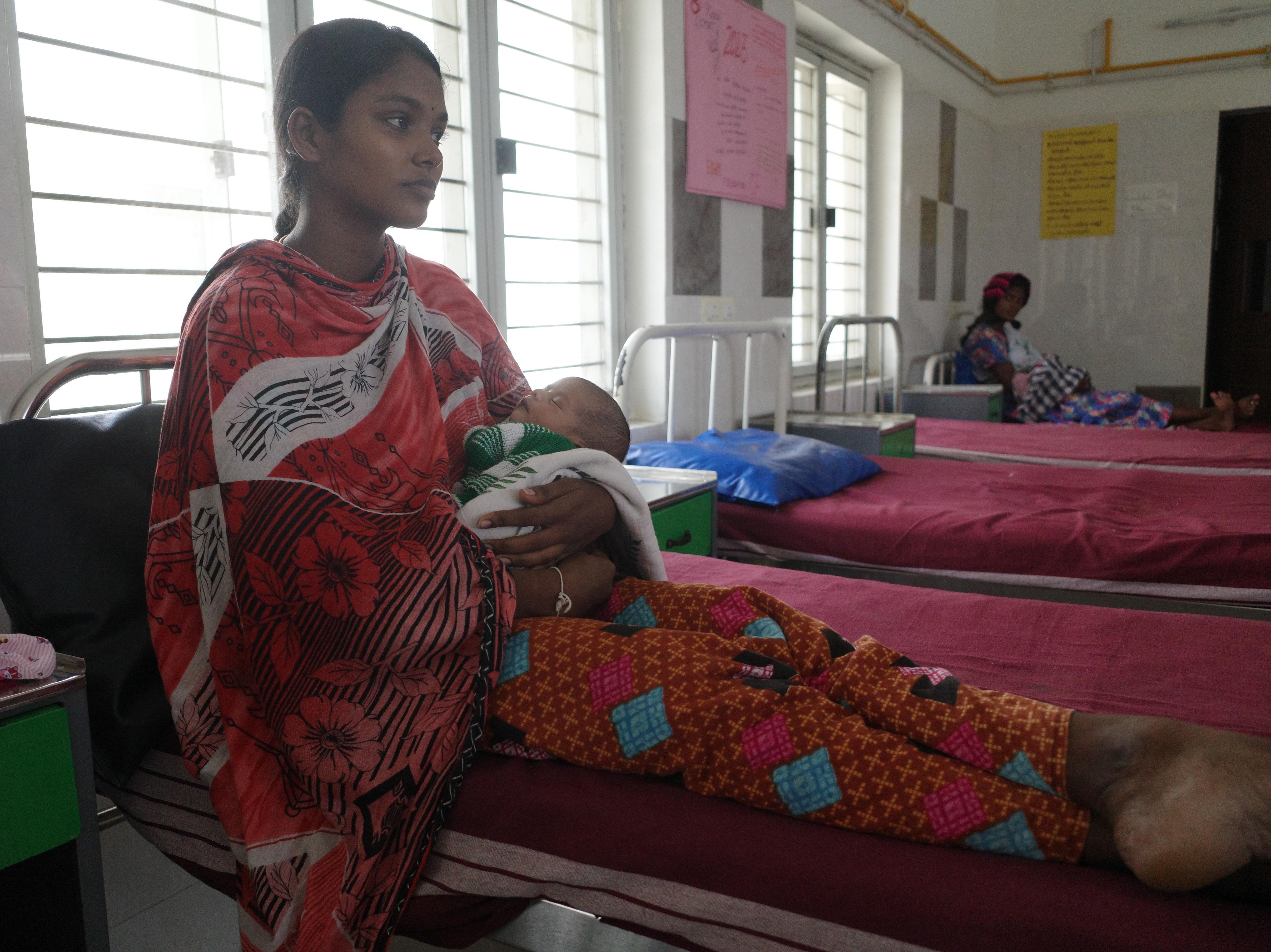 Vaishnavi Logabiran holds her daughter – she was sterilised days after the birth of her second child