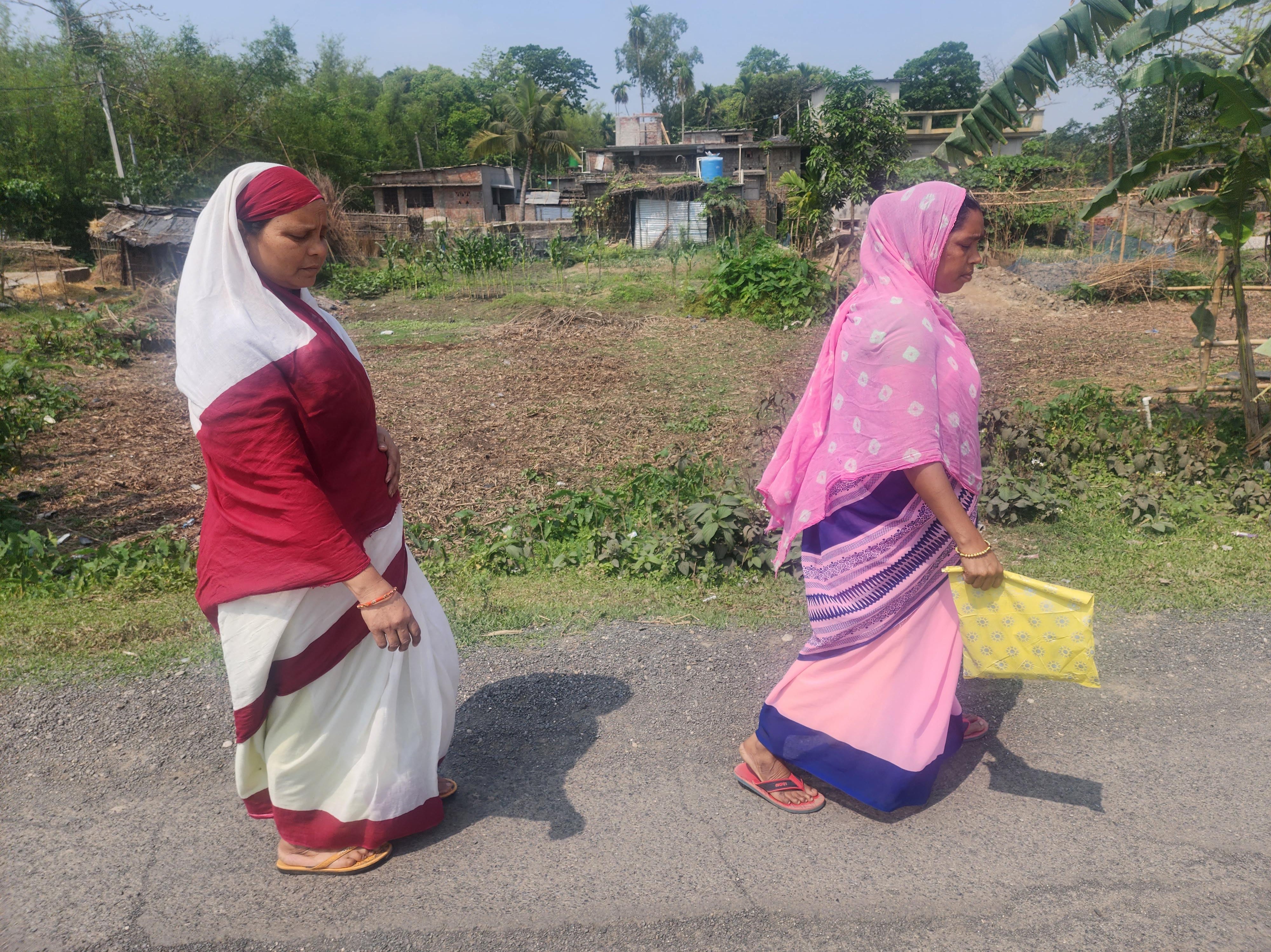 Nusrat Jahan and her colleague Nasiba Jahan walk across Sontha village, educating women on family planning options