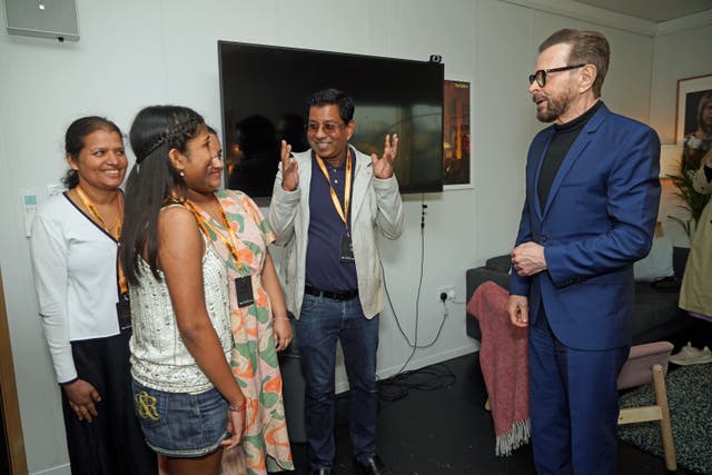 Josie Felix, the one millionth customer at ABBA Voyage, (second left) with sister Emily (hidden, father Sunny (centre) and mother Jeney (left), as she meets Bjorn Ulvaeus from ABBA, at the ABBA Arena in London. Picture date: Monday April 17, 2023.