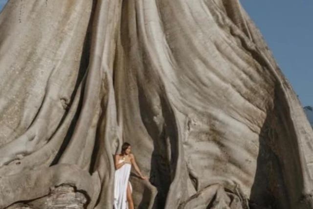 <p>Ni Luh Djelantik, who describes herself as an entrepreneur, posted photos of the Russian tourist (pictured above) who posed nude in front of the sacred, ancient tree in Bali</p>