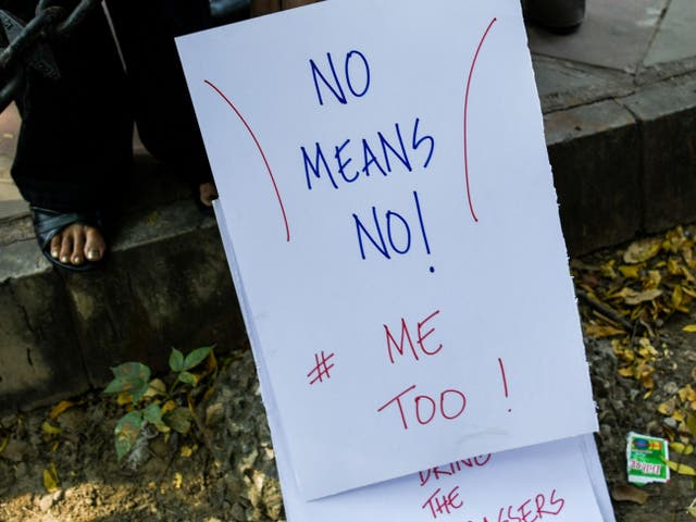 <p>File: Protesters holds a placard at a protest against sexual harassment in New Delhi on 13 October 2018</p>