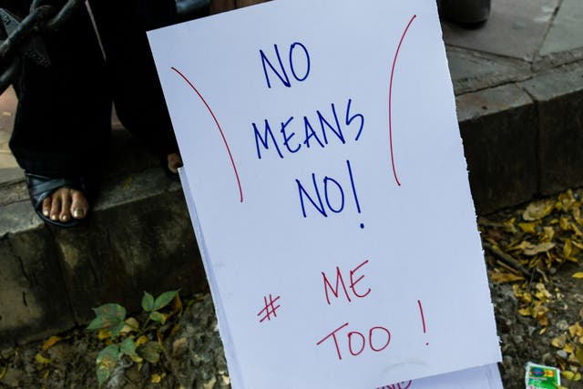 <p>File: Protesters holds a placard at a protest against sexual harassment in New Delhi on 13 October 2018</p>