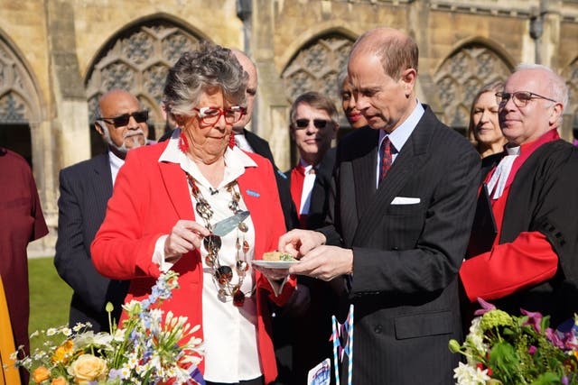 The Duke of Edinburgh tries the official coronation quiche with Coronation Big Lunch Ambassador Dame Prue Leith (James Manning/PA)
