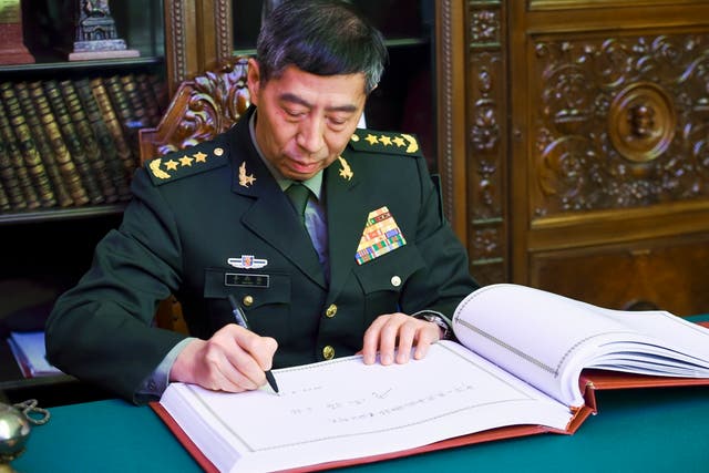 <p>File. In this handout photo released by Russian Defense Ministry Press Service, China's Defense Minister Gen. Li Shangfu signs the book of honoured visitors after visiting to Military Academy of the General Staff of the Armed Forces of the Russian Federation in Moscow, Russia, Monday, April 17, 2023</p>