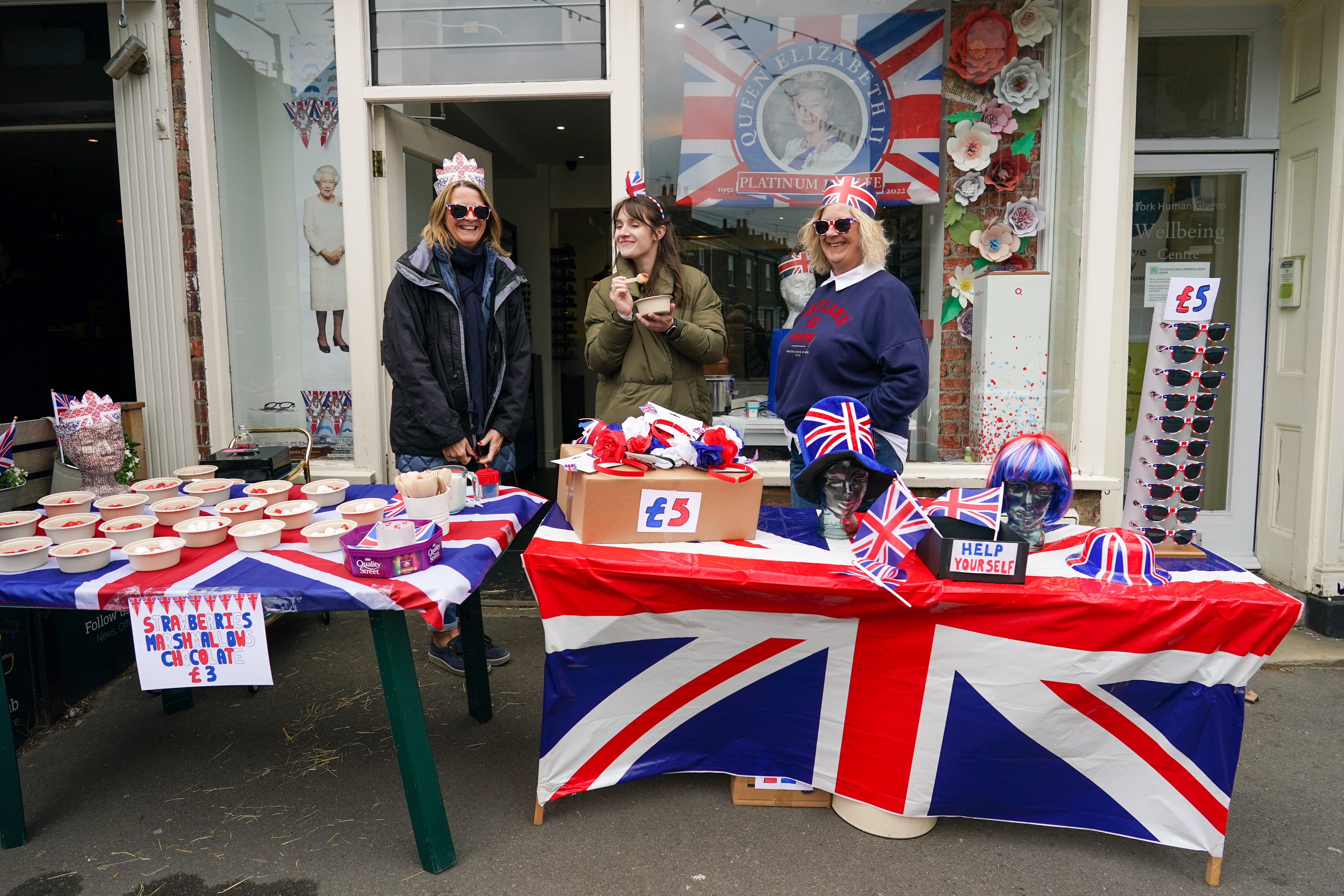 Shop owners join in with the fun during the Bishopthorpe Road Street Party celebrating the Queen’s platinum jubilee on 5 June 2022 in York