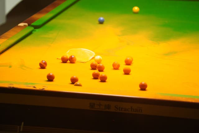 Orange powder on a snooker table after a protester jumped on it during the match between Robert Milkins and Joe Perry at the Crucible Theatre, Sheffield (PA)