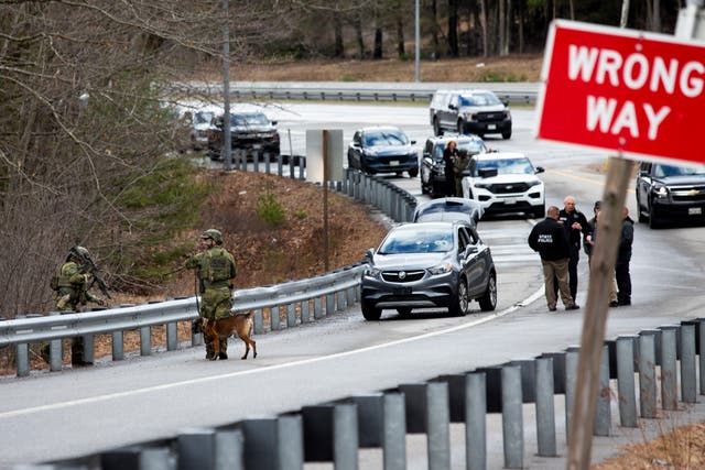 <p>Members of law enforcement investigate a scene where people were injured in a shooting on Interstate 295, in Yarmouth, Maine, Tuesday, April 18, 2023. Gunfire that erupted on the busy highway in Maine is linked to a second crime scene where people have been found dead in a home about 25 miles away in the town of Bowdoin, Maine, state police said Tuesday. (Derek Davis/Portland Press Herald via AP)</p>