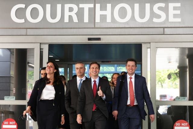 <p>Dominion Voting Systems CEO John Poulos (2nd L) leaves with members of his legal team, including Davida Brook, Justin Nelson and Stephen Shackelford</p>