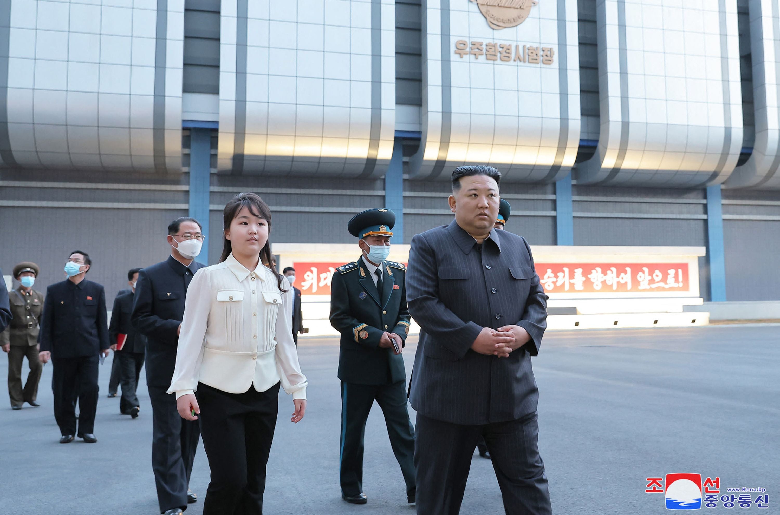 North Korean leader Kim Jong-un and his daughter inspecting the National Aerospace Development Administration