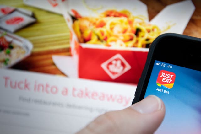Online food delivery giant Just Eat Takeaway.com has increased its earnings guidance for 2023 despite seeing another steep fall in orders (Joe Giddens/PA)