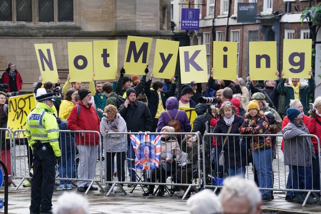 Protesters await the arrival of Charles and the Queen Consort for the Royal Maundy Service at York Minster (Owen Humphreys/PA)