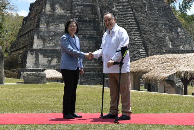 <p>Taiwan’s president Tsai Ing-wen shakes hands with her Guatemalan counterpart Alejandro Giammattei, on a tour of the Mayan ruins at Tikal, Guatemala</p>