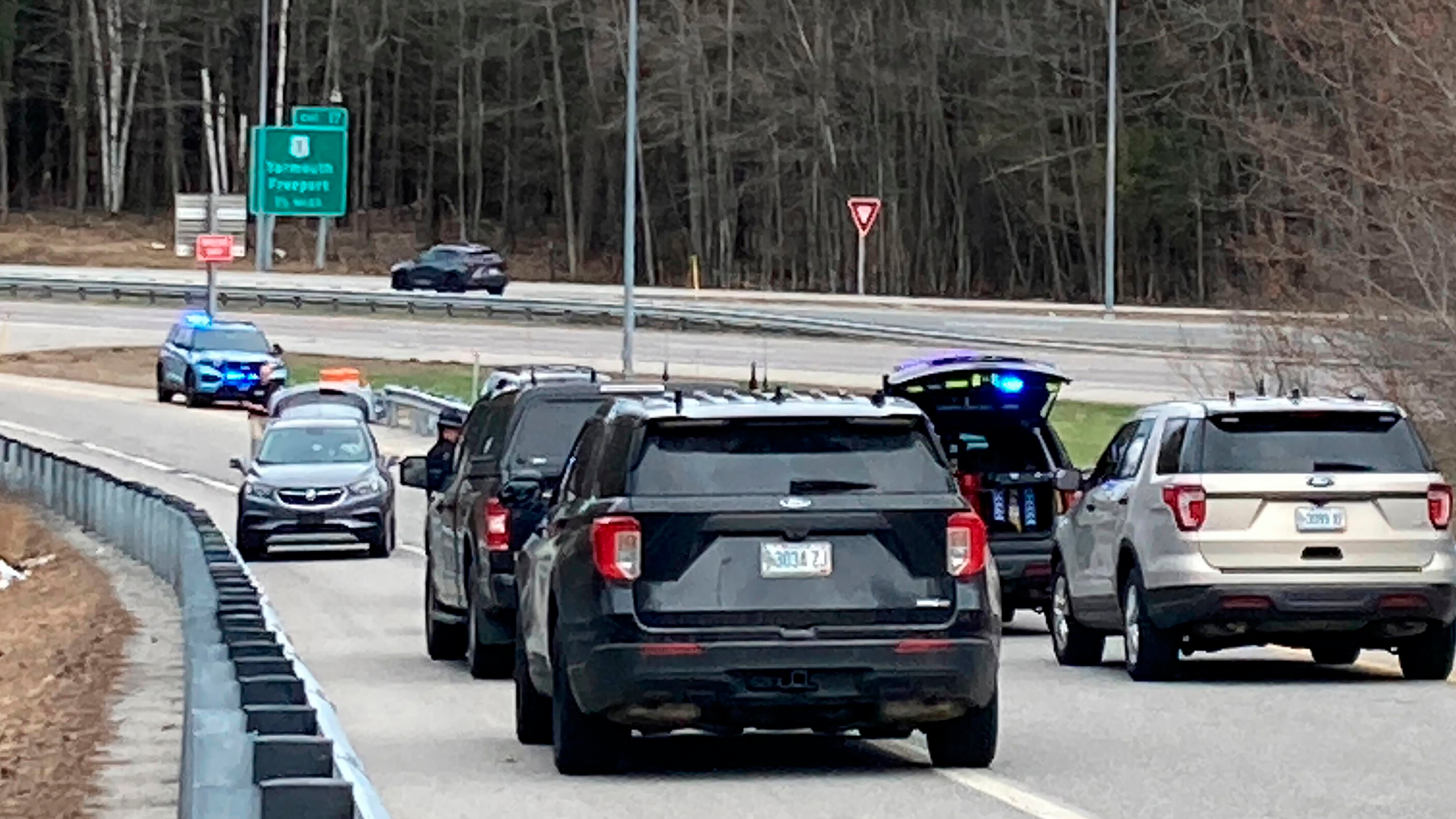Vehicles are stopped on a highway at a scene where people were injured in a shooting on Interstate 295 in Yarmouth, Maine, Tuesday, April 18, 2023
