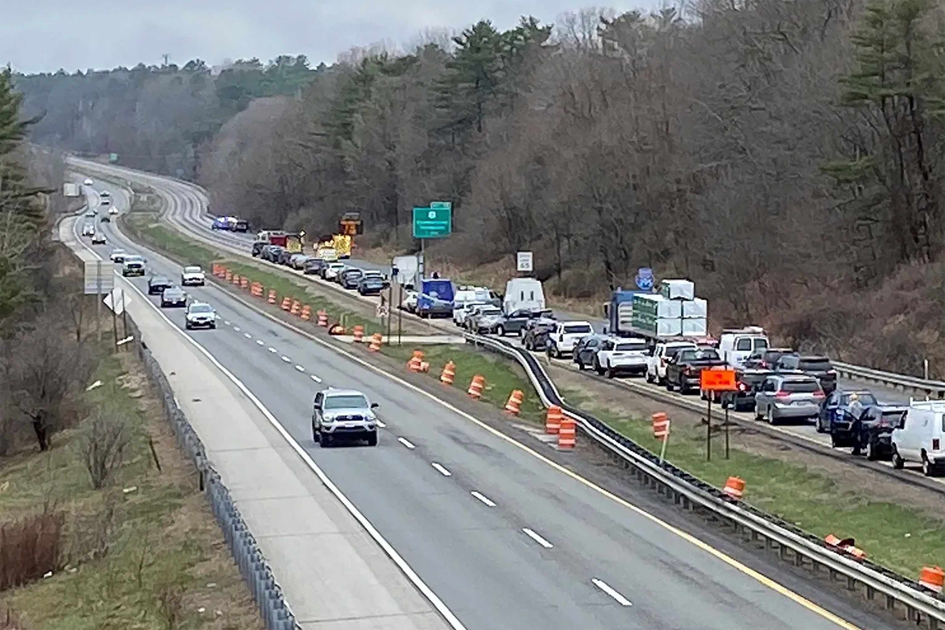 In a still frame from video provided by WGME-TV traffic is backed up near a scene where people were injured in a shooting on Interstate 295, in Yarmouth, Maine, Tuesday, April 18, 2023