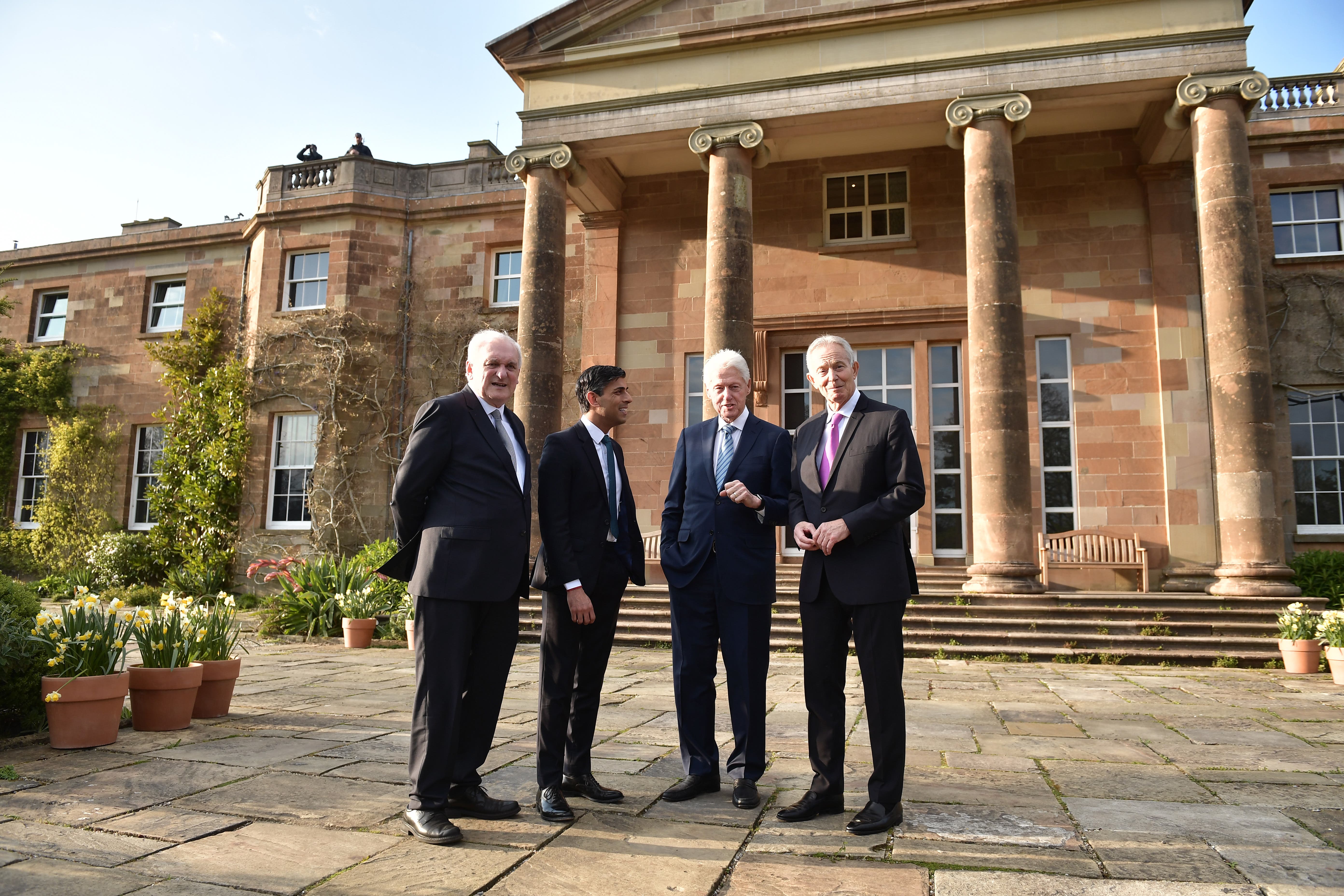 (Left-right) Former taoiseach Bertie Ahern, Prime Minister Rishi Sunak, former US president Bill Clinton and former prime minister Sir Tony Blair stand outside Hillsborough Castle, Co Down, ahead of a gala dinner (PA)