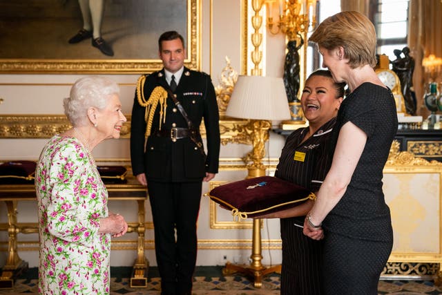 Queen Elizabeth II presented the George Cross to Amanda Pritchard, chief executive of NHS England, and May Parsons (Aaron Chown/PA)