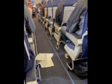 Flight attendant won’t let plane leave until passengers clean up mess dropped in the aisle