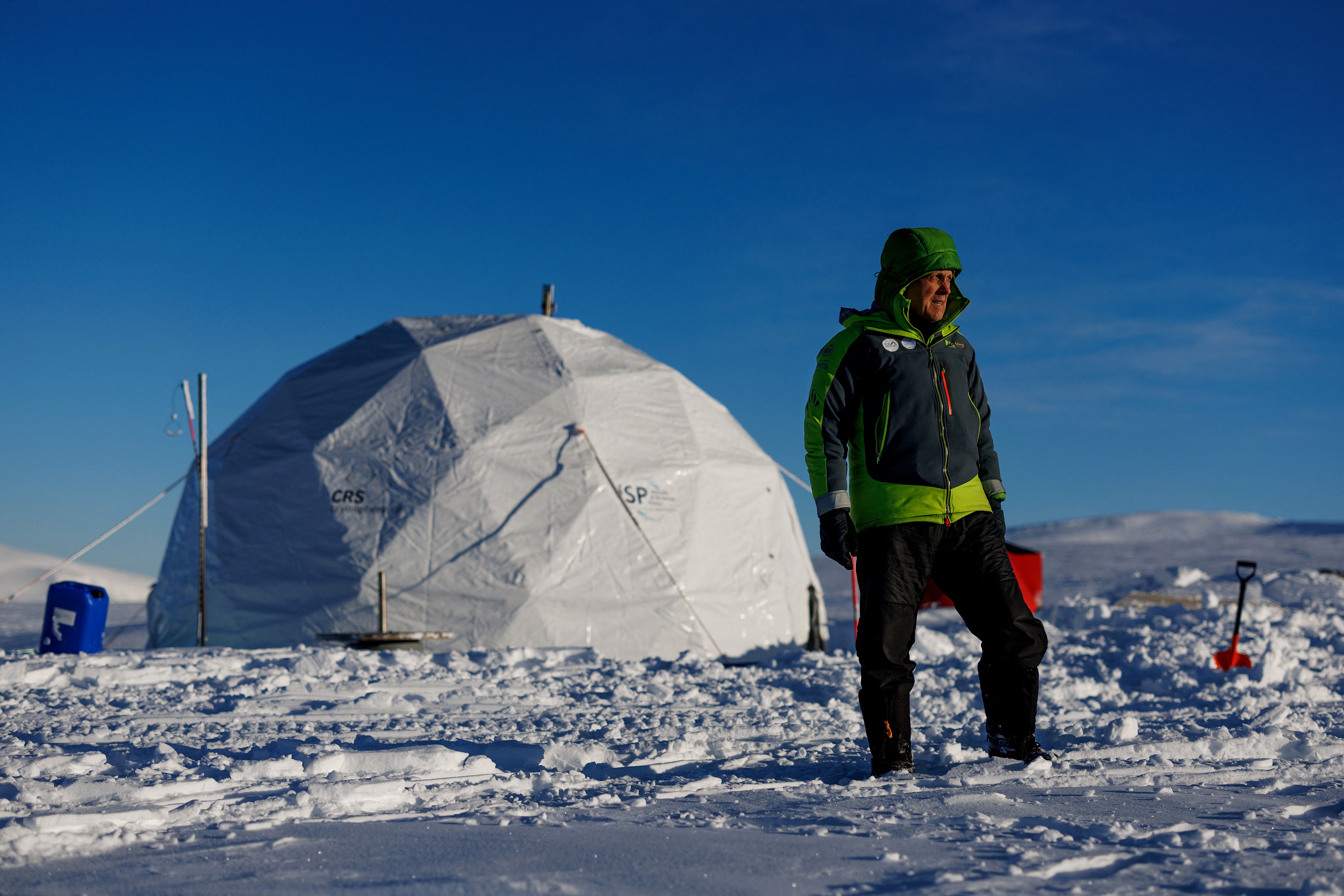 Ice Memory driller operator Victor Zagorodnov poses for a picture in front of the drilling tent