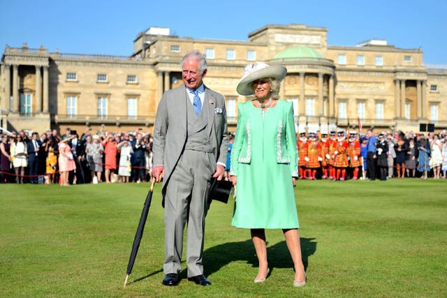 <p>Charles and Camilla during a garden party at Buckingham Palace</p>