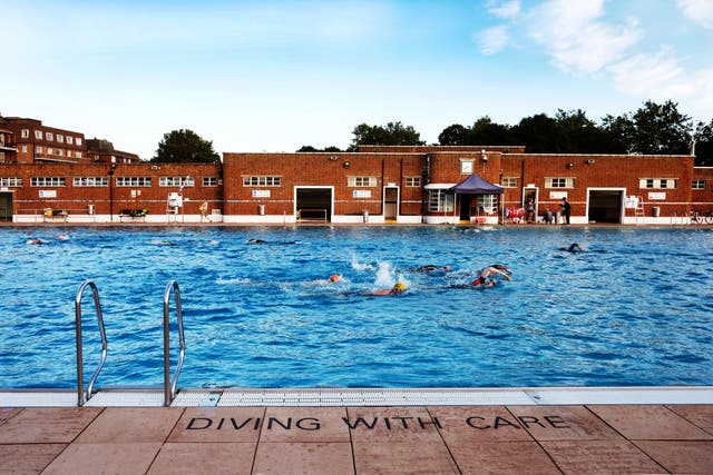 <p>Swimmers in Parliament Hill Lido </p>
