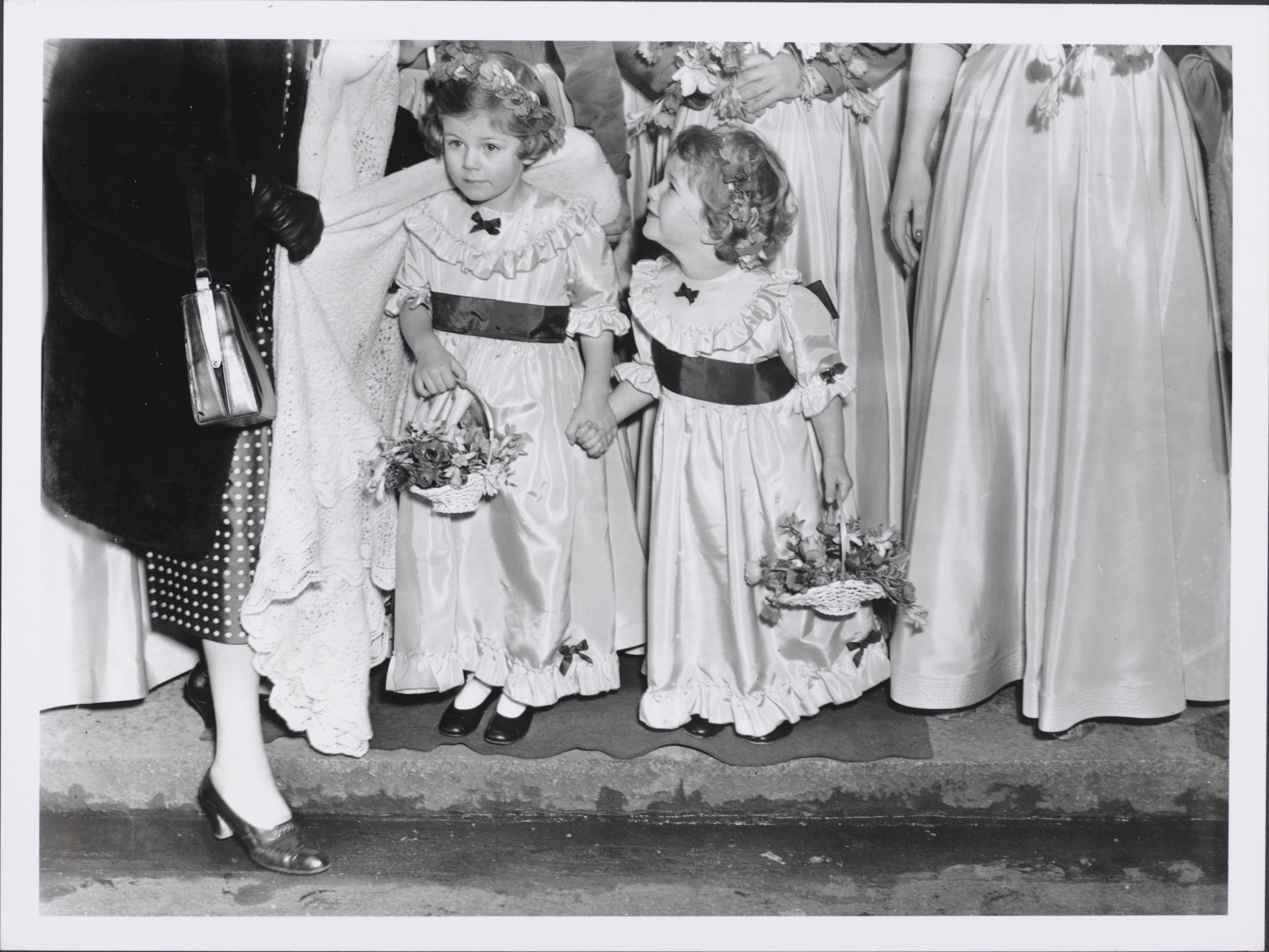 Camilla, aged four, and her sister Annabelle, aged three, as bridesmaids for the wedding of Jeremy Gubbitt and Diana du Cane in 1952
