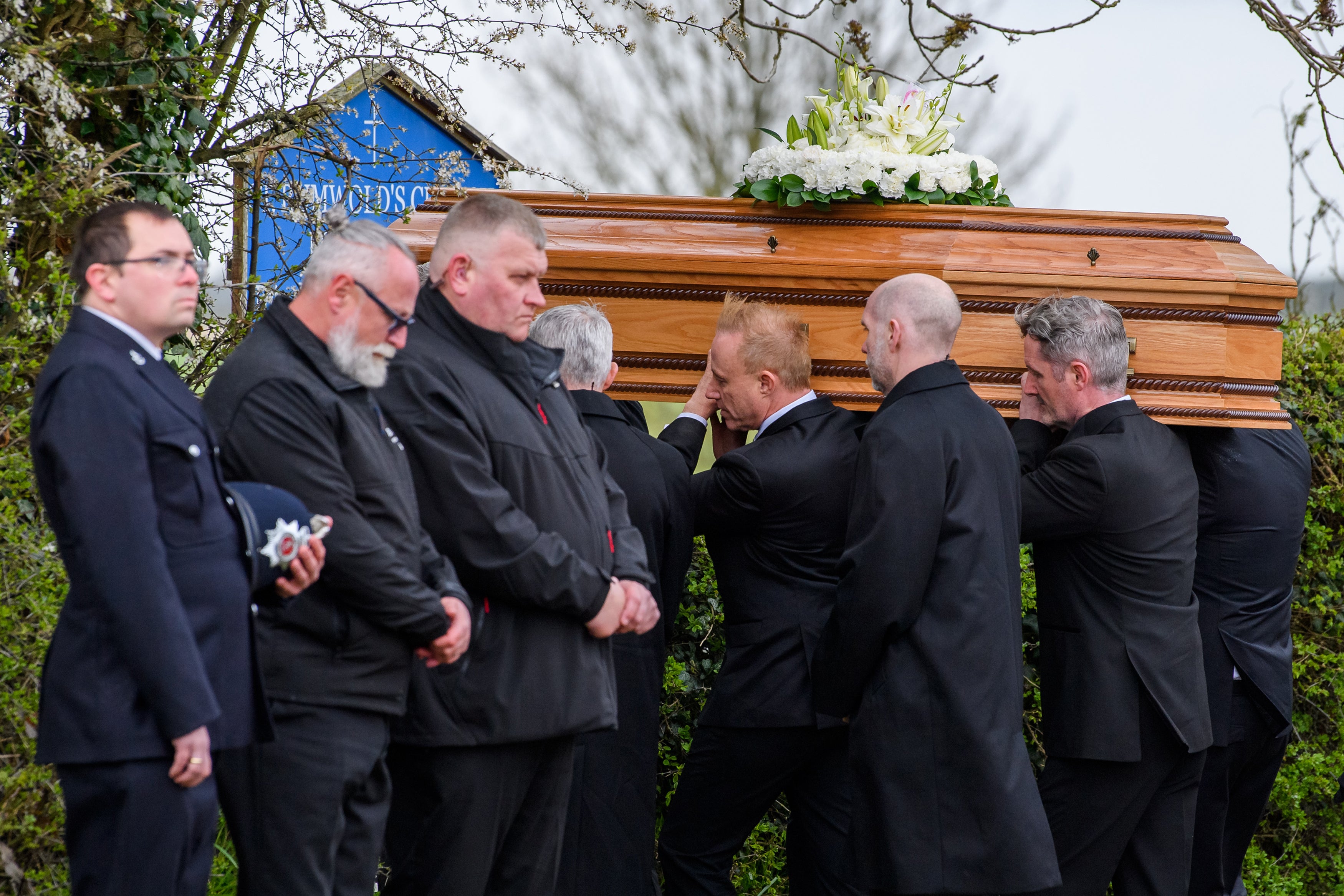 The coffin of Paul O’Grady is carried into the church in Aldington, Kent