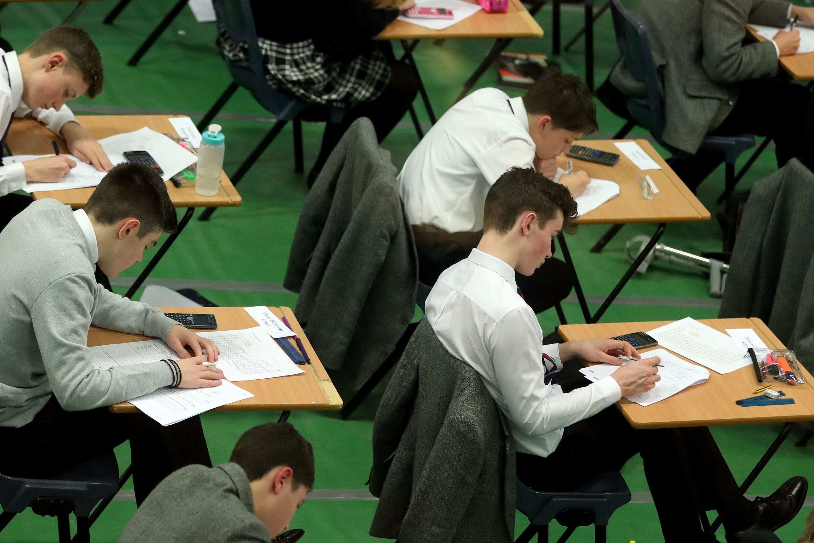 Written exams should continue to be the main method for assessing students’ knowledge and understanding, a report says (PA)