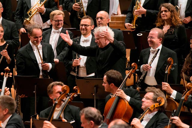 <p>Simon Rattle directing the Berlin Philharmonic</p>