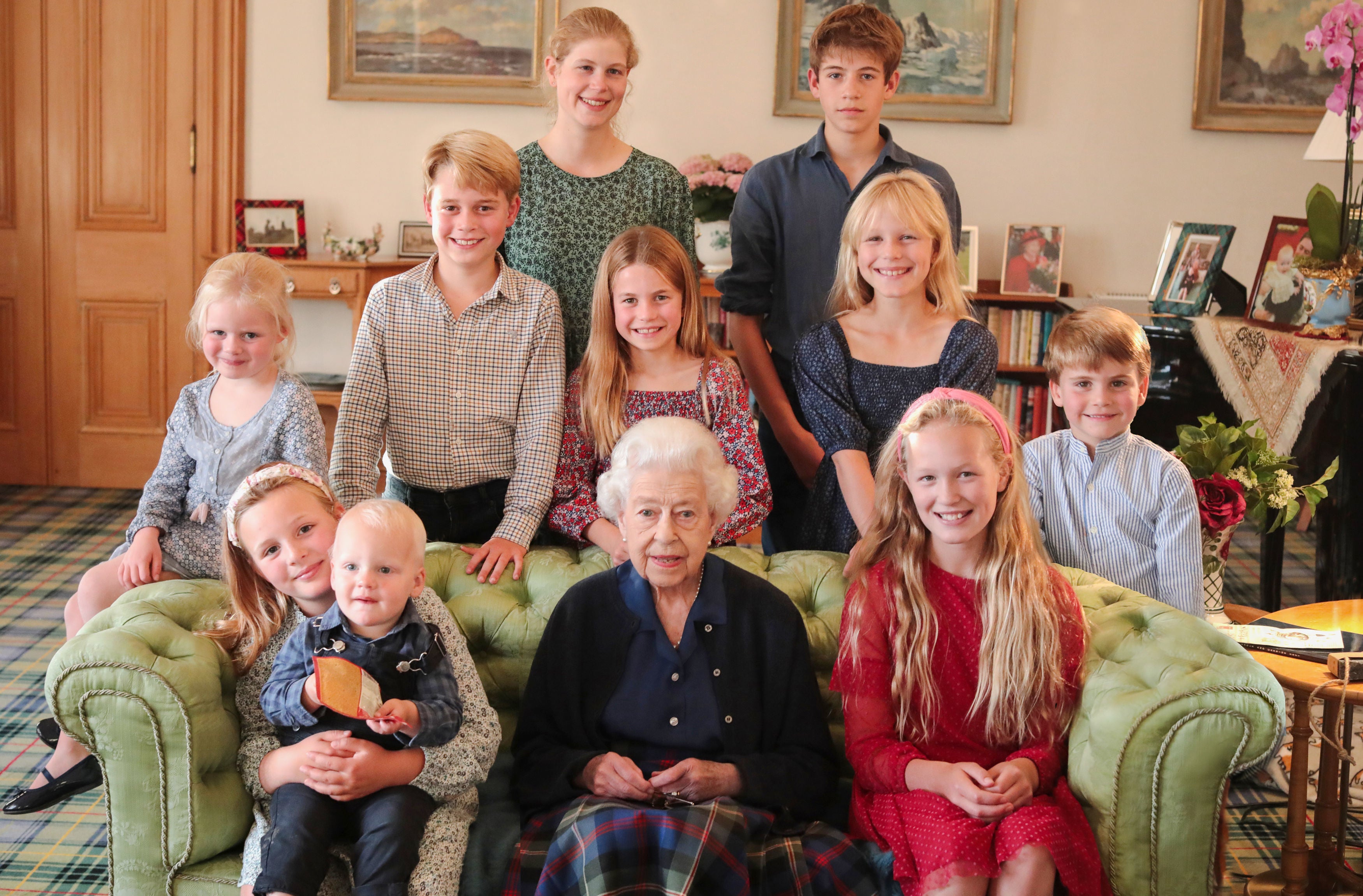 The photograph was taken by the Princess of Wales at Balmoral last summer and shows the Queen with some of her grandchildren and great grandchildren (back row, left to right) Lady Louise Mountbatten-Windsor and James, Earl of Wessex, (middle row, left to right) Lena Tindall, Prince George, Princess Charlotte, Isla Phillips, Prince Louis, and (front row, left to right) Mia Tindall holding Lucas Tindall, Queen Elizabeth II and Savannah Phillips.