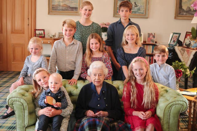 The late Queen surrounded by grandchildren and great-grandchildren