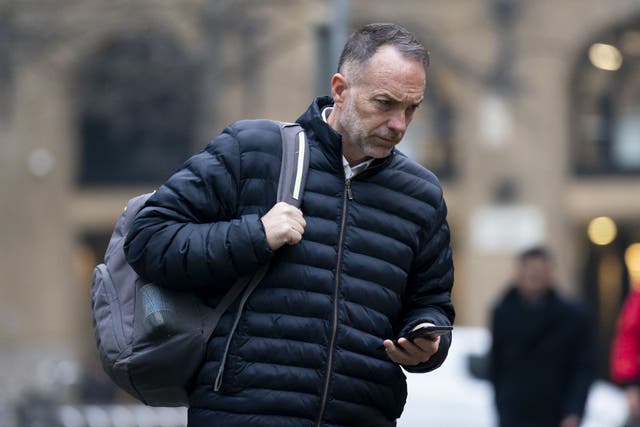 <p>Former police sergeant Frank Partridge arrives at Southwark Crown Court in London, where he is one of eight people accused of bribery offences</p>