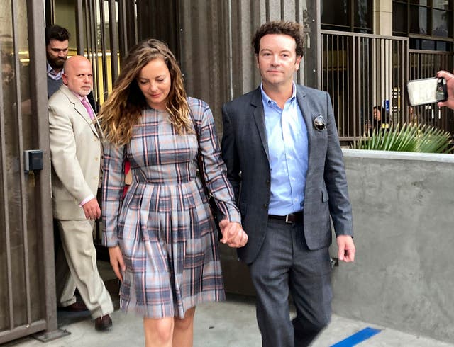 <p>FILE - Actor Danny Masterson leaves Los Angeles superior Court with his wife Bijou Phillips after a judge declared a mistrial in his rape case in Los Angeles on Nov. 30, 2022.</p>