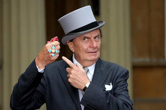 <p>Barry Humphries after he received his OBE (Officer of the Order of the British Empire) from the Queen at Buckingham Palace, London (Steve Parsons/PA)</p>