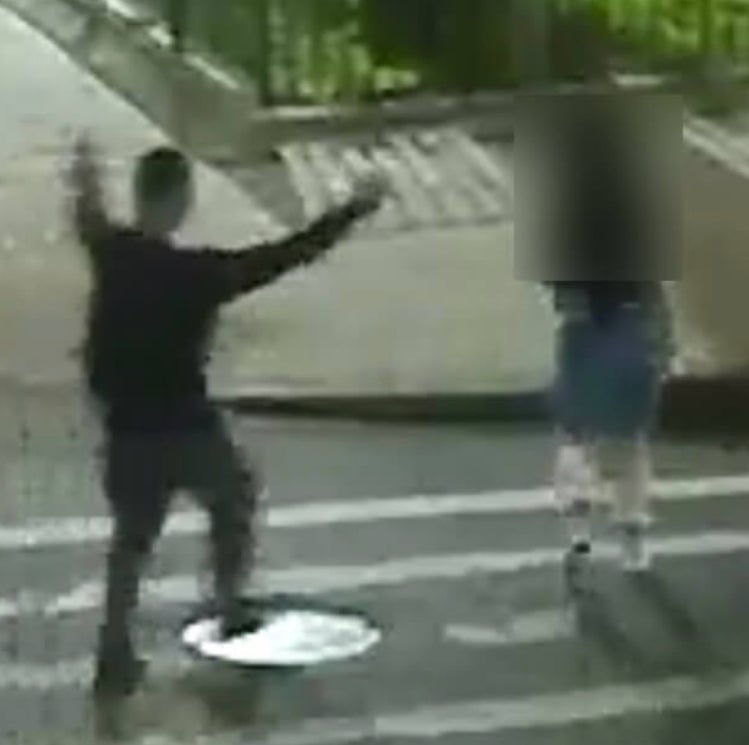 Surveillance image shows a man approaching a woman at a crosswalk before Brooklyn kidnapping