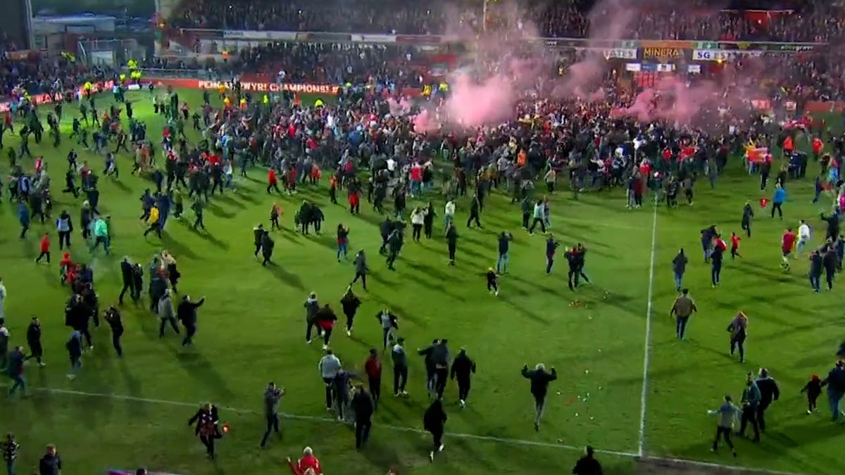 Wrexham fans flood the pitch after historic 3-1 win over Boreham Wood