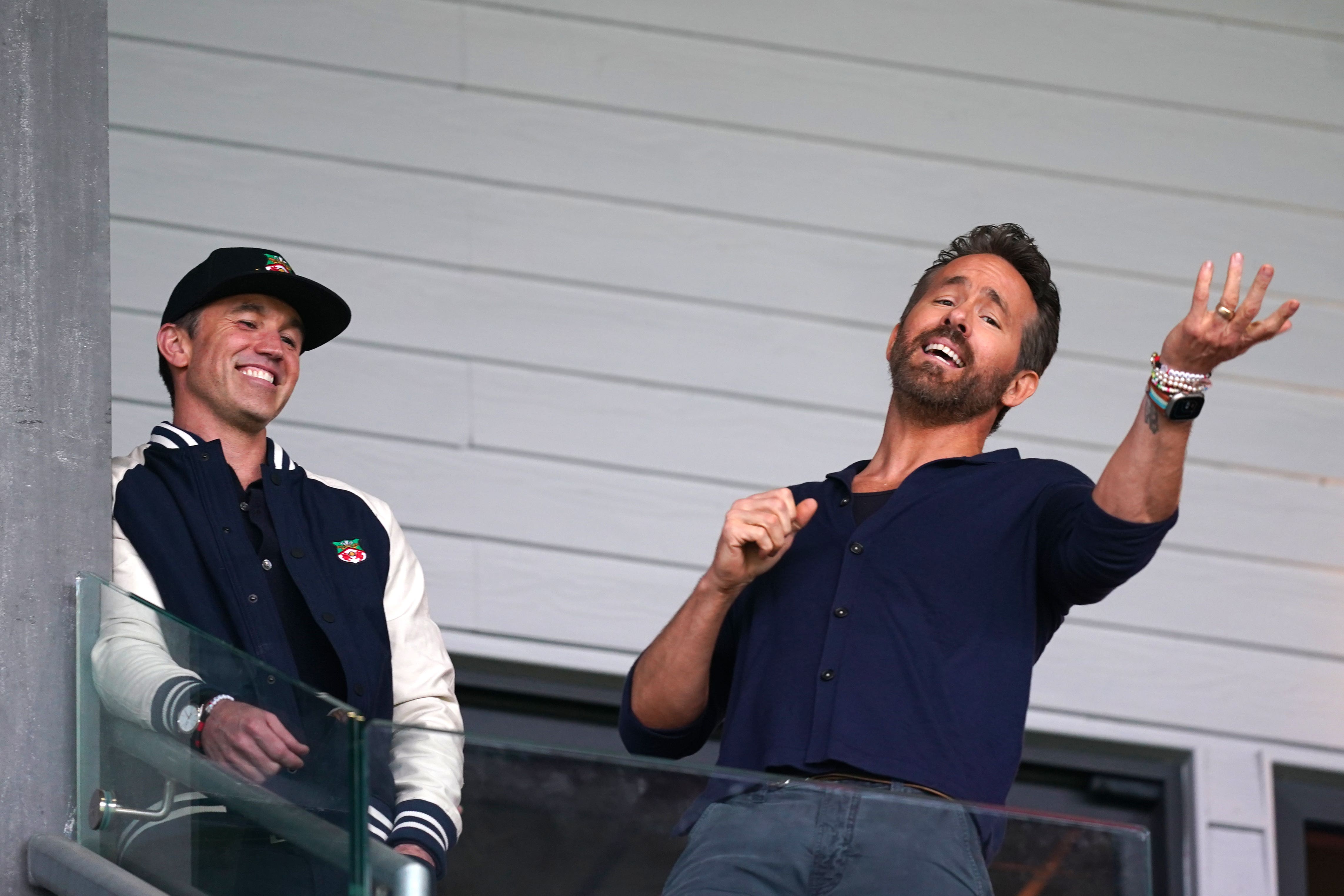 Wrexham co-owners Rob McElhenney (left) and Ryan Reynolds react in the stands during the Vanarama National League win over Boreham Wood (Martin Rickett/PA)