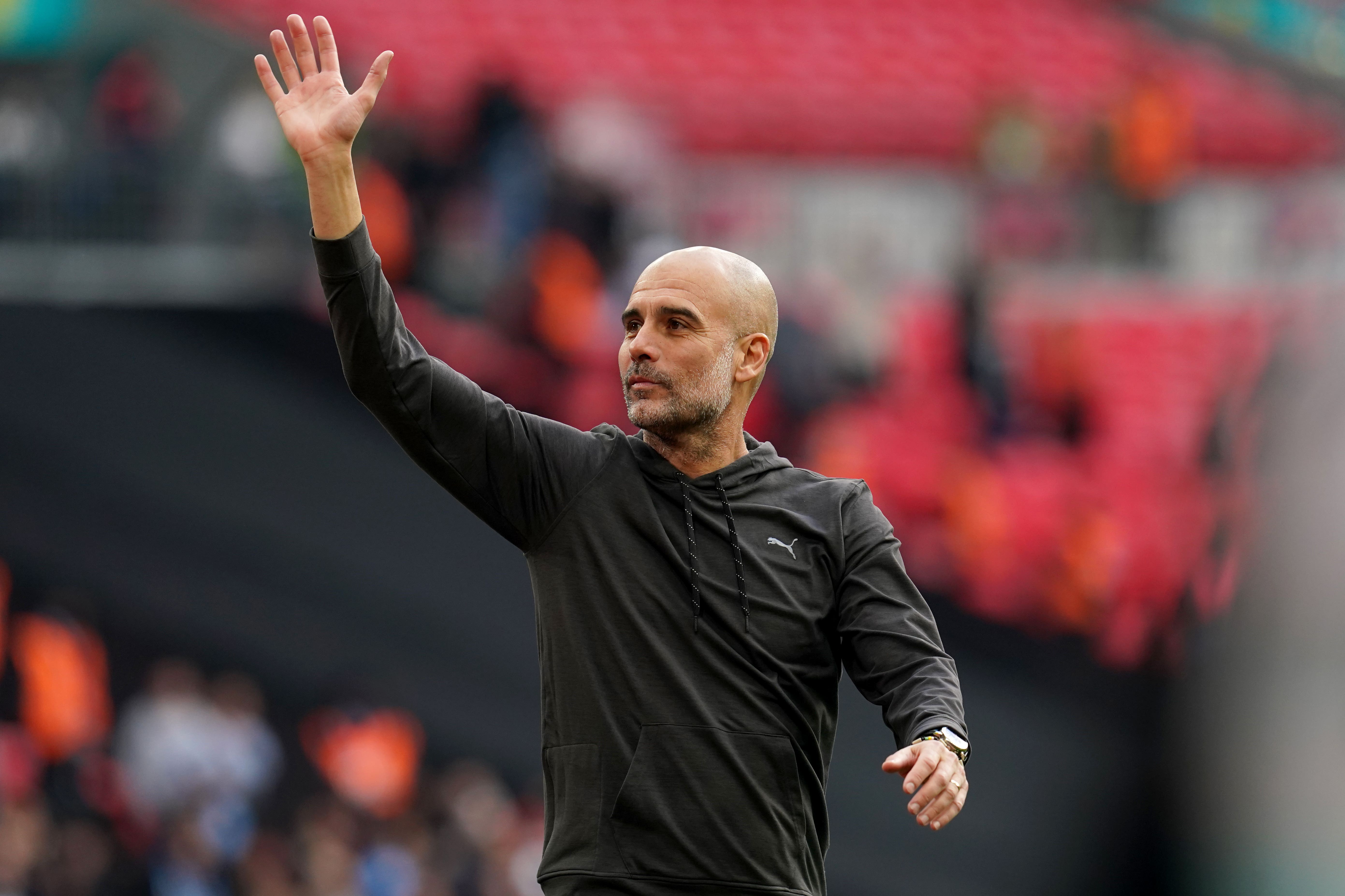 Manchester City manager Pep Guardiola salutes to the fans after the win (PA)