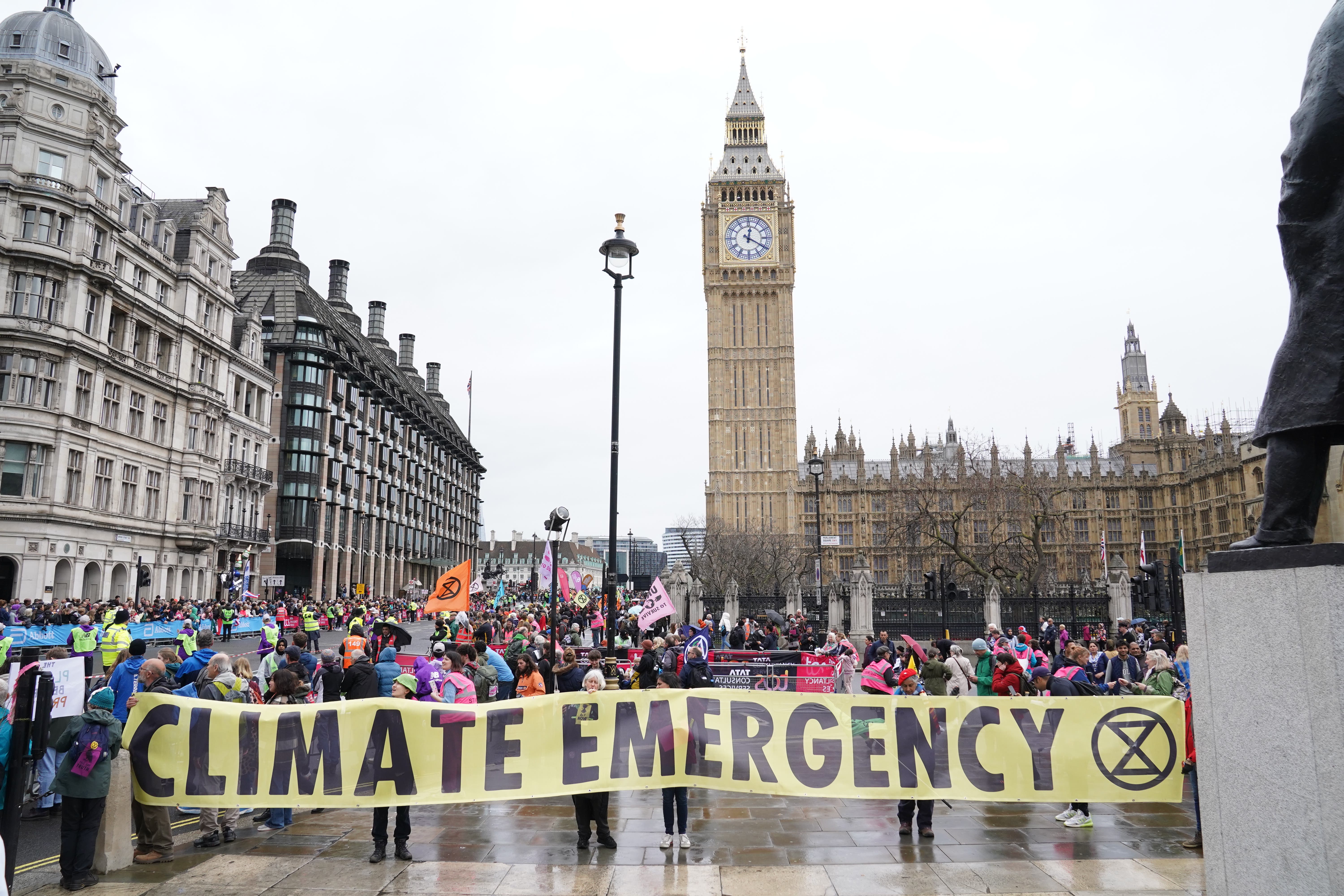 Extinction Rebellion demonstrators take part in a rally in London (Stefan Rousseau/PA)