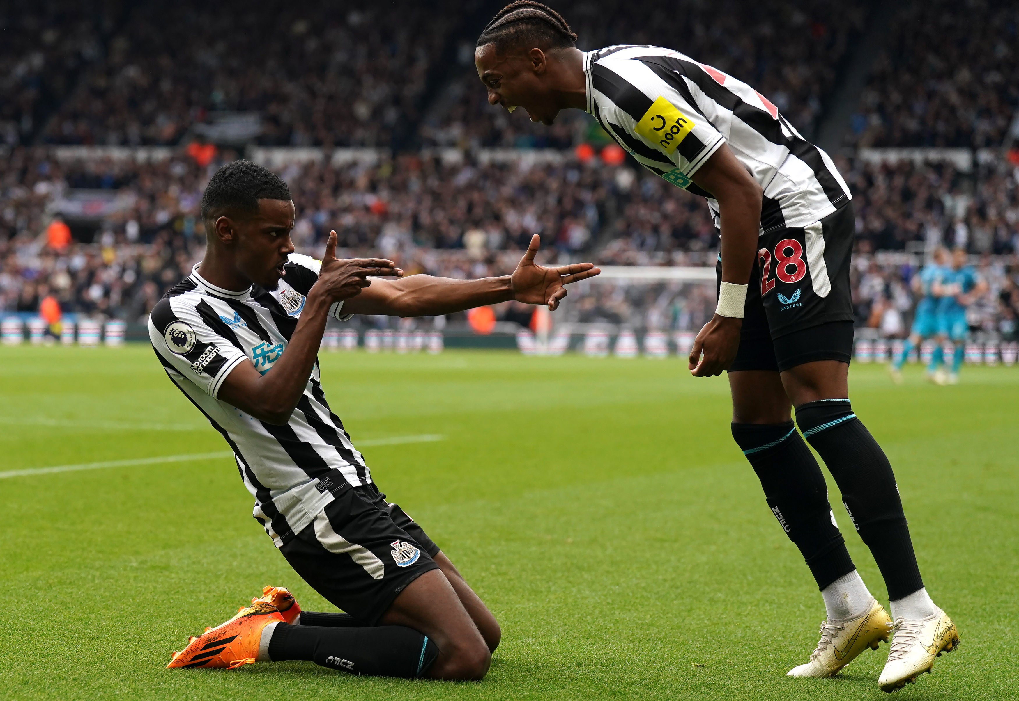 Alexander Isak celebrates with teammate Joe Willock after scoring Newcastle’s fourth goal of the game