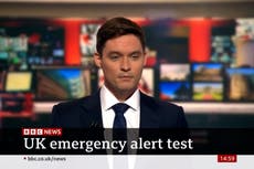 Moment BBC newsreader interrupted by emergency alert live on air