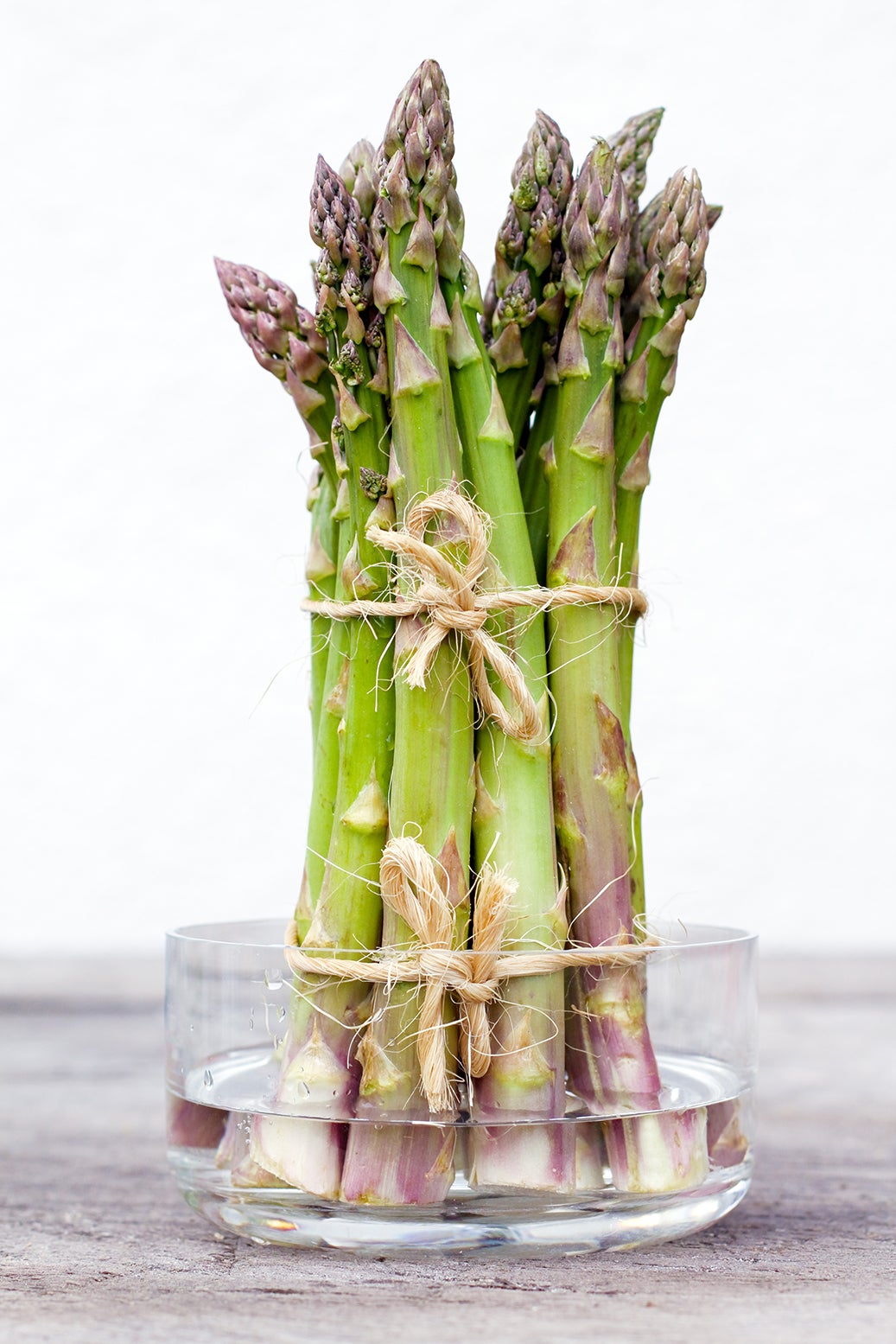Reinvigorate sad asparagus by trimming the ends and placing upright in water