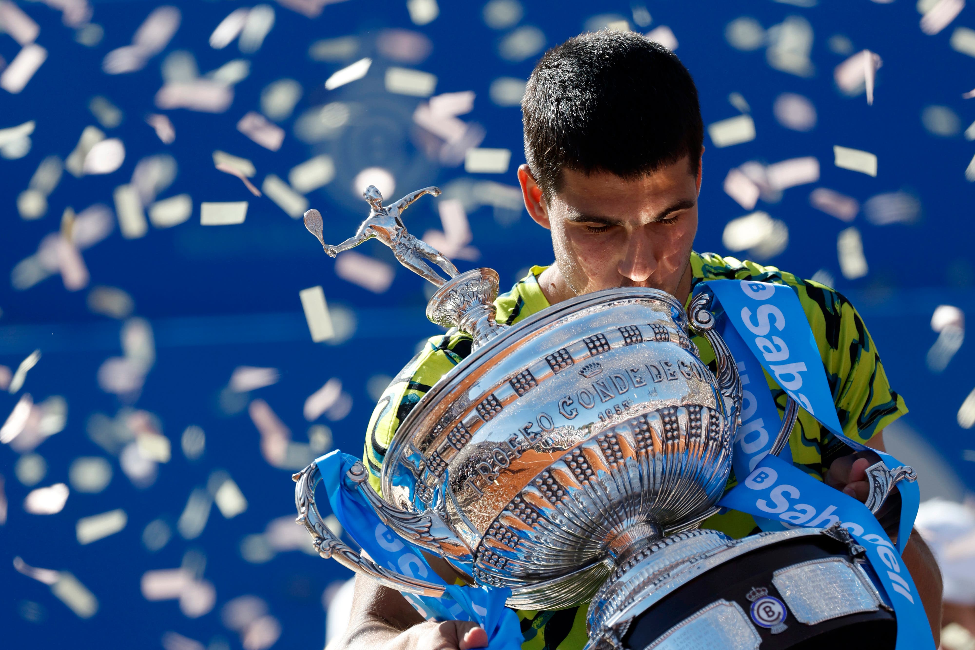 Carlos Alcaraz kisses the Barcelona Open trophy (Joan Monfort/AP)