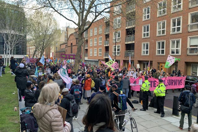 Extinction Rebellion demonstrators hold a small boats protest outside the Home Office (Lucas Cumiskey/PA)