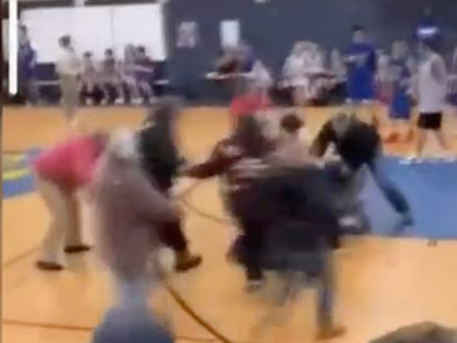 <p>A brawl had broken out between spectators at a middle school basketball game</p>