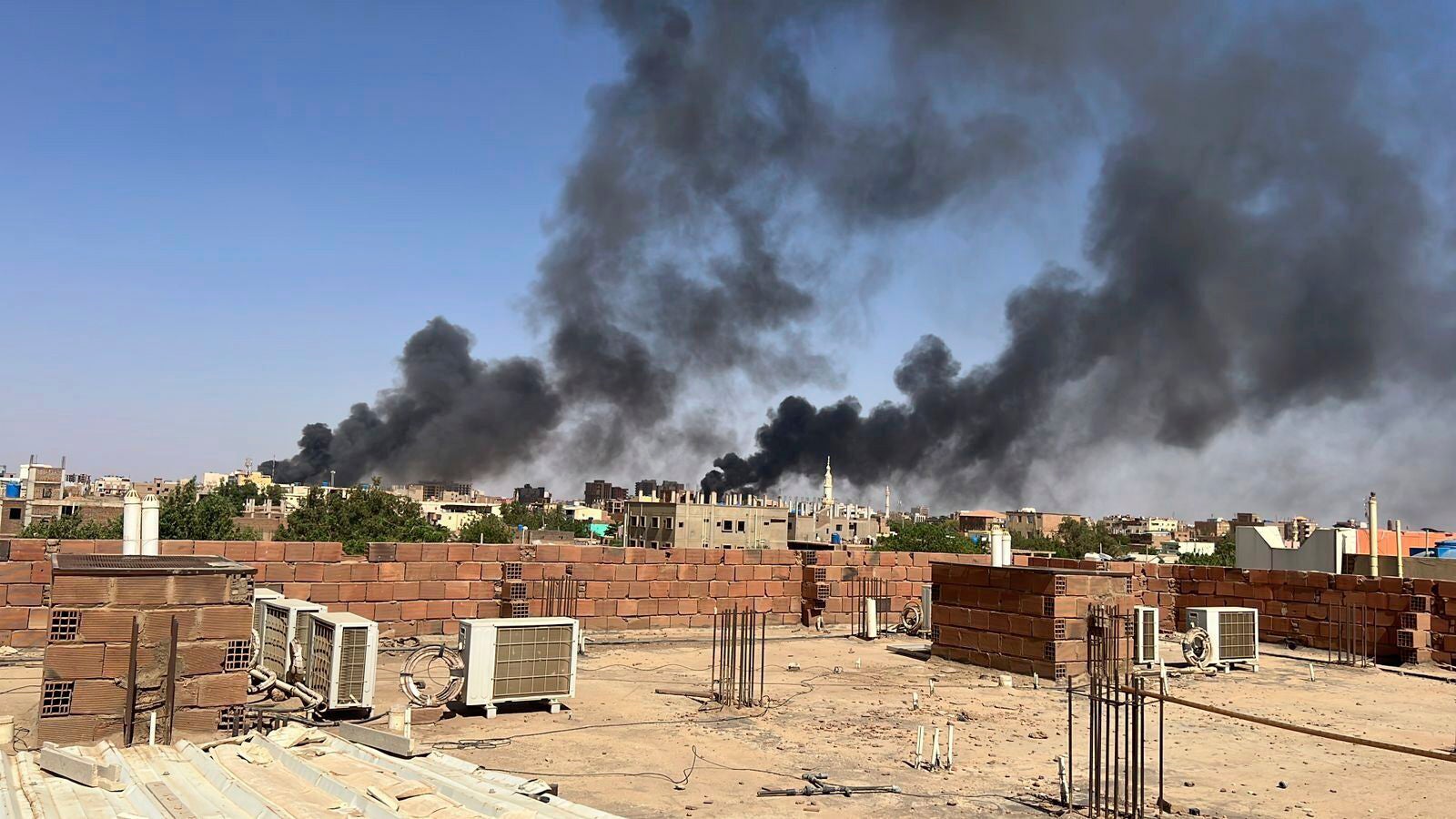 Smoke fills the sky in Khartoum amid increasing violence and dwindling supplies