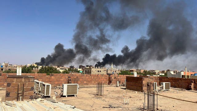 <p>Smoke fills the sky in Khartoum, where Ms Elwasila said she saw dead bodies on the street before she fled there with her family</p>