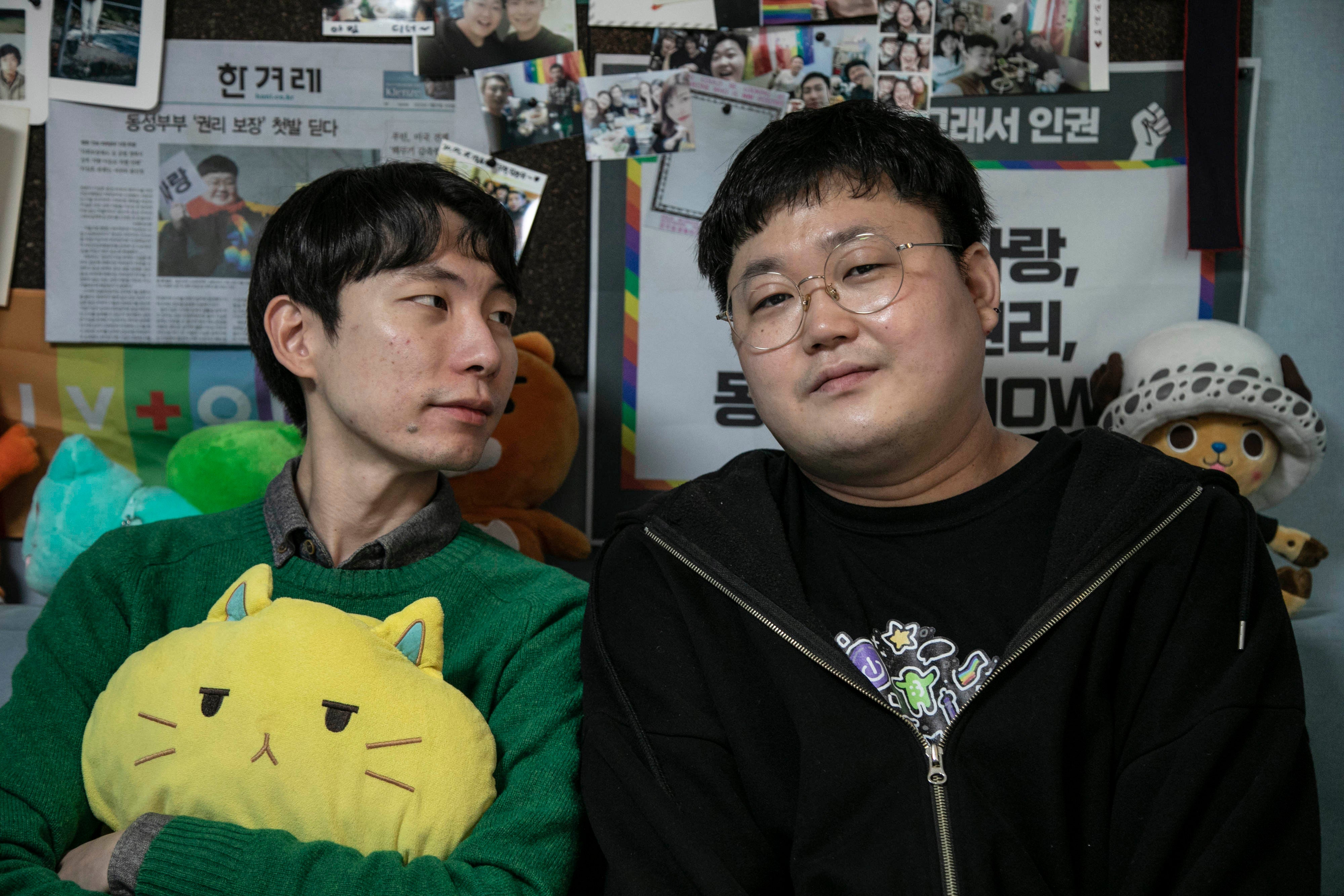 Kim Yong-min, left, and So Sung-wook took legal action after they were told same-sex partners were not eligible to be listed as dependents on health insurance