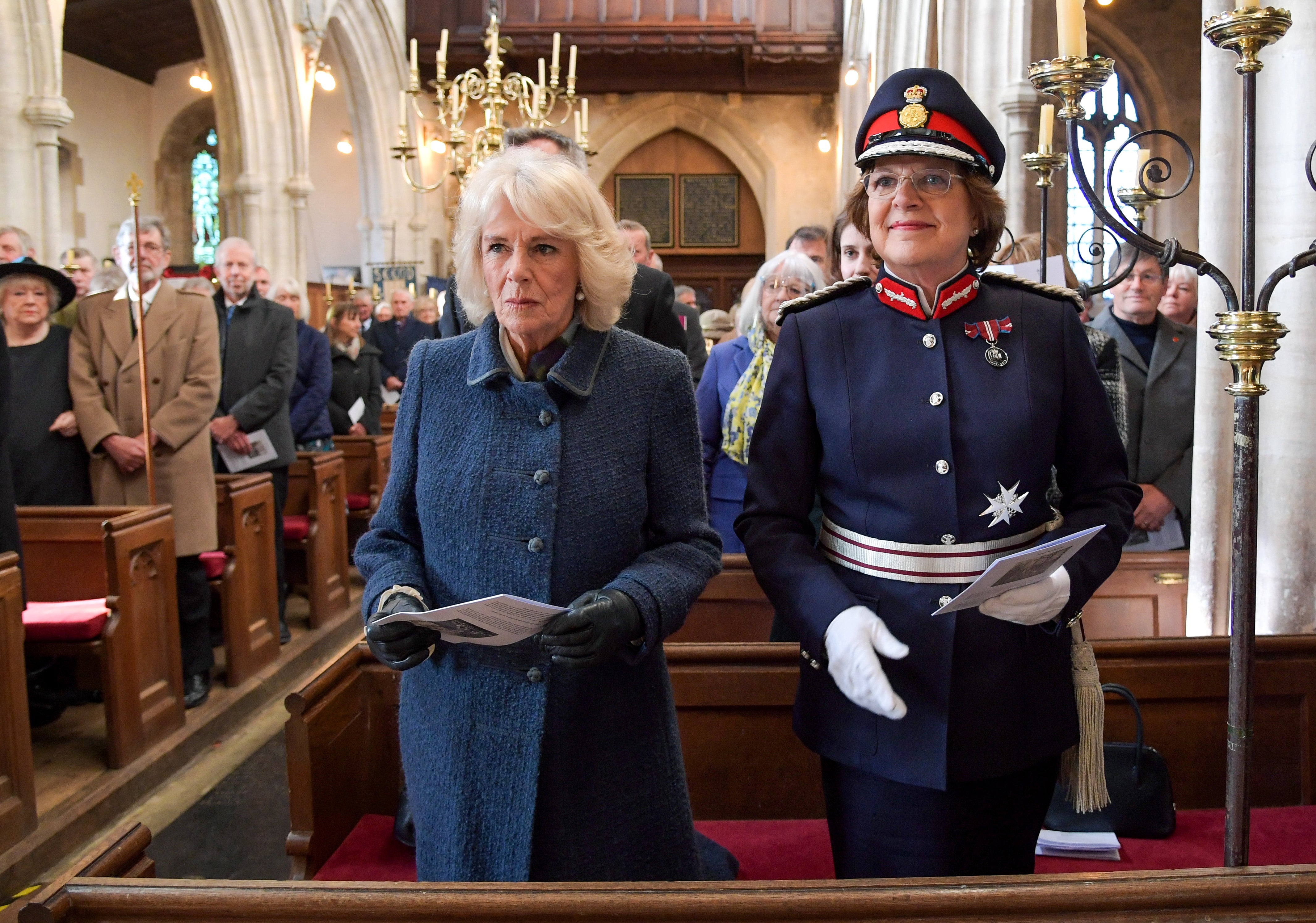 Camilla, Duchess of Cornwall and Lord-Lieutenant of Wilshire, Mrs Sarah Troughton attend a church service during a visit to Wiltshire on December 02, 2021